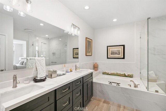 3510 Lilac Ave Unit 13, Corona Del Mar, CA 92625 - ensuite bathroom with a bath, a marble finish shower, double vanity, wood finished floors, and recessed lighting