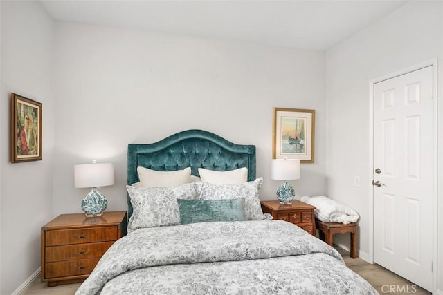 3510 Lilac Ave Unit 13, Corona Del Mar, CA 92625 - bedroom featuring baseboards and wood finished floors
