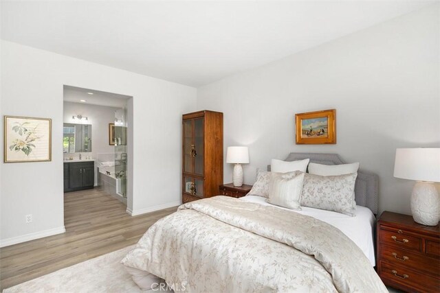 3510 Lilac Ave Unit 13, Corona Del Mar, CA 92625 - bedroom with light wood-style floors and ensuite bathroom