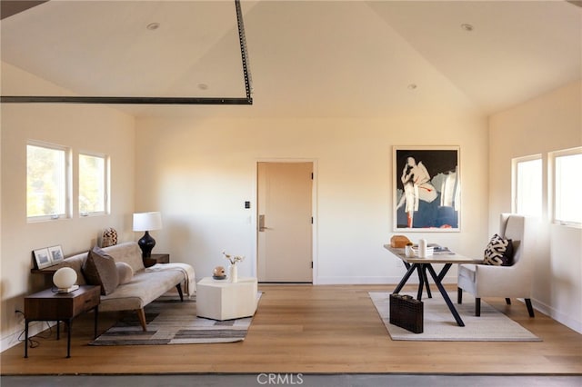 3554 S Sycamore Ave, Los Angeles, CA 90016 - living room with healthy amount of natural light, wood finished floors, baseboards, and high vaulted ceiling