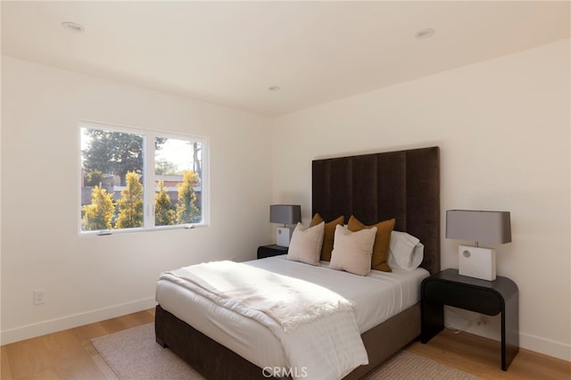 3554 S Sycamore Ave, Los Angeles, CA 90016 - bedroom featuring light wood-style floors, baseboards, and recessed lighting
