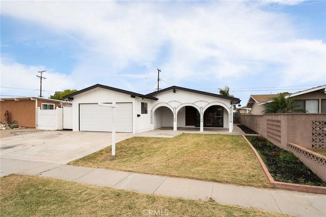 12340 Dune St, Norwalk, CA 90650 - ranch-style home featuring an attached garage, concrete driveway, covered porch, and stucco siding