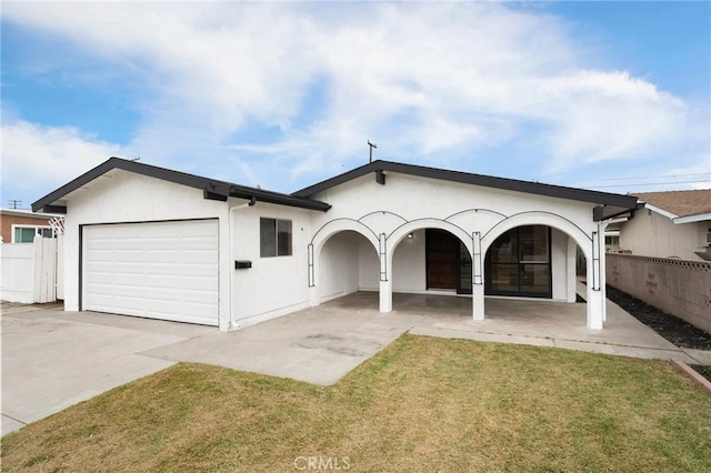 12340 Dune St, Norwalk, CA 90650 - view of front of property featuring concrete driveway, an attached garage, and stucco siding