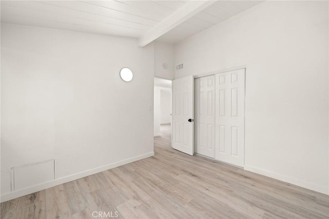 12340 Dune St, Norwalk, CA 90650 - unfurnished bedroom with wood finished floors, baseboards, a closet, wooden ceiling with exposed beams, and high vaulted ceiling