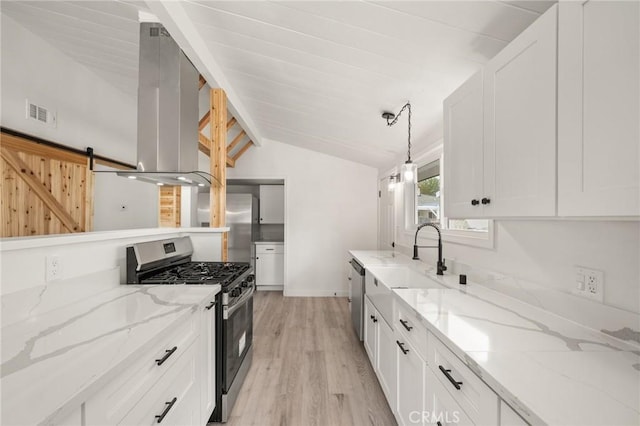 12340 Dune St, Norwalk, CA 90650 - kitchen with stainless steel appliances, lofted ceiling, white cabinetry, ventilation hood, and light wood-style floors
