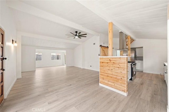 12340 Dune St, Norwalk, CA 90650 - unfurnished living room with light wood finished floors, a ceiling fan, a barn door, and baseboards