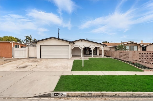 12340 Dune St, Norwalk, CA 90650 - ranch-style home with concrete driveway, an attached garage, stucco siding, and a porch