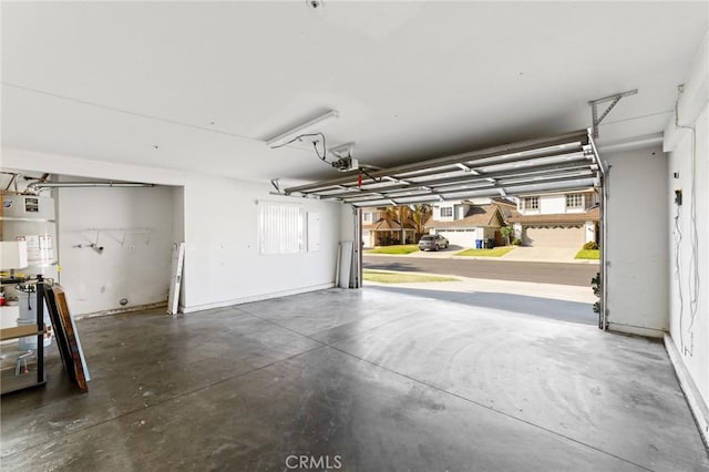 16207 Trailwinds Dr, Fontana, CA 92337 - garage featuring secured water heater and a garage door opener