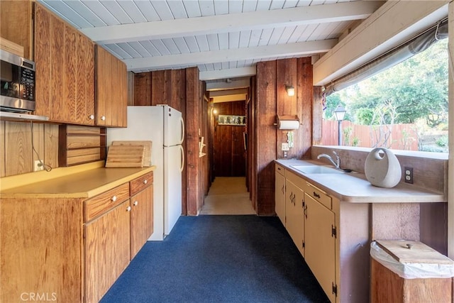 4899 Glenwood Dr, Riverside, CA 92501 - kitchen featuring a sink, light countertops, stainless steel microwave, freestanding refrigerator, and carpet floors