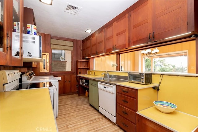 4899 Glenwood Dr, Riverside, CA 92501 - kitchen featuring white appliances, light wood-style flooring, light countertops, open shelves, and washing machine and clothes dryer