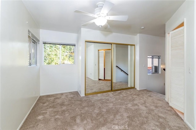 4899 Glenwood Dr, Riverside, CA 92501 - unfurnished bedroom featuring carpet floors, two closets, baseboards, and ceiling fan