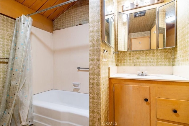 4899 Glenwood Dr, Riverside, CA 92501 - full bathroom featuring wallpapered walls, vanity, shower / tub combo with curtain, and lofted ceiling