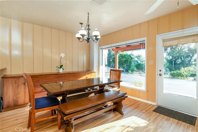 4899 Glenwood Dr, Riverside, CA 92501 - dining area featuring light wood-style floors, a chandelier, and healthy amount of natural light