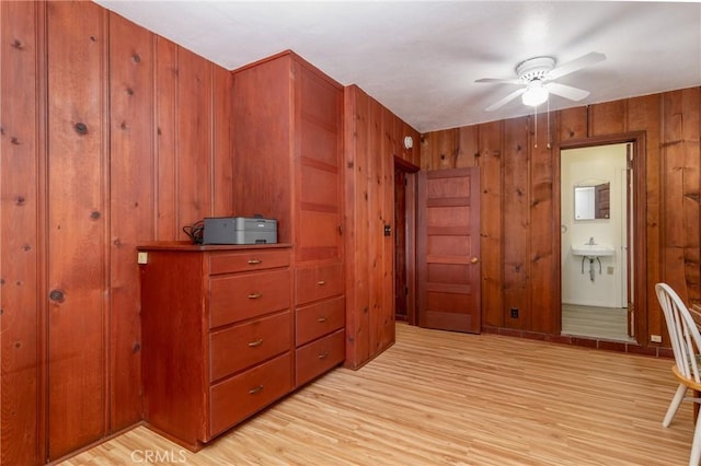 4899 Glenwood Dr, Riverside, CA 92501 - bedroom with light wood-type flooring, wooden walls, and ensuite bathroom