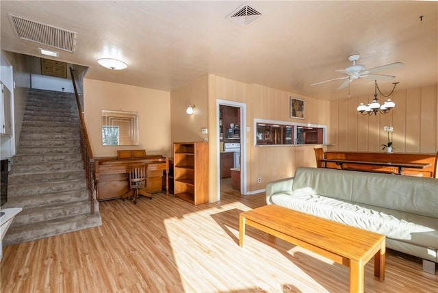 4899 Glenwood Dr, Riverside, CA 92501 - living area featuring wood finished floors, stairway, and ceiling fan