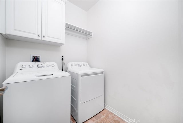8675 Bay Laurel St, Chino, CA 91708 - laundry room with cabinet space, washing machine and dryer, and baseboards
