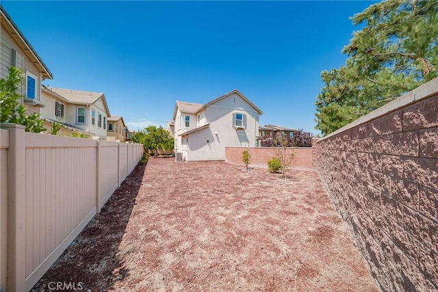 8675 Bay Laurel St, Chino, CA 91708 - rear view of property featuring a fenced backyard and a residential view