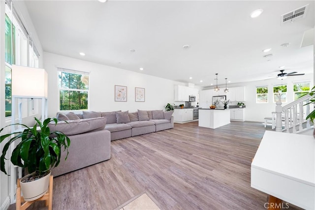 8675 Bay Laurel St, Chino, CA 91708 - living area featuring recessed lighting, ceiling fan, and wood finished floors