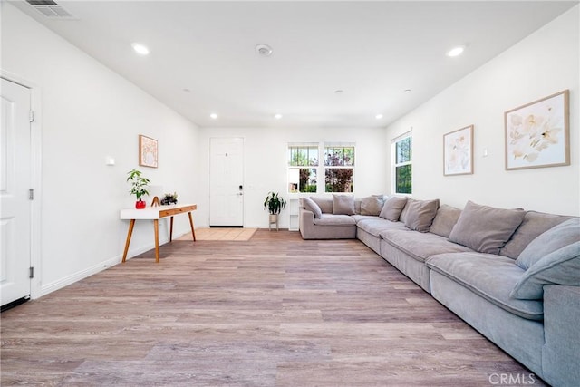 8675 Bay Laurel St, Chino, CA 91708 - living room with light wood-style floors and recessed lighting