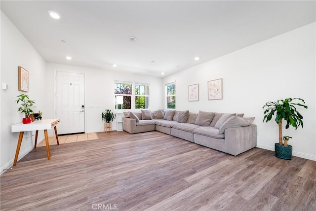 8675 Bay Laurel St, Chino, CA 91708 - living area with recessed lighting, light wood-style floors, and baseboards
