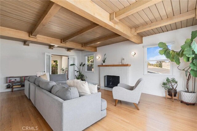 4501 Don Miguel Dr, Los Angeles, CA 90008 - living area with light wood-style floors, a fireplace, and wood ceiling with exposed beams