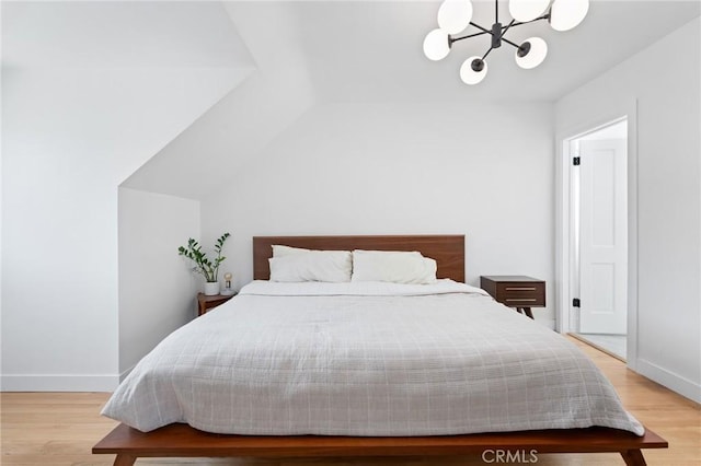 4501 Don Miguel Dr, Los Angeles, CA 90008 - bedroom with a chandelier, light wood-type flooring, baseboards, and vaulted ceiling