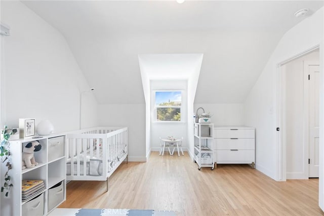 4501 Don Miguel Dr, Los Angeles, CA 90008 - bedroom featuring vaulted ceiling, wood finished floors, and baseboards