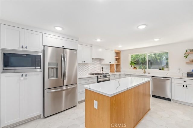 4501 Don Miguel Dr, Los Angeles, CA 90008 - kitchen with stainless steel appliances, open shelves, white cabinetry, light tile patterned floors, and recessed lighting