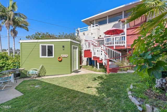 2740 Auburn St, Los Angeles, CA 90039 - back of house with a lawn, an outbuilding, stairway, a deck, and a patio area