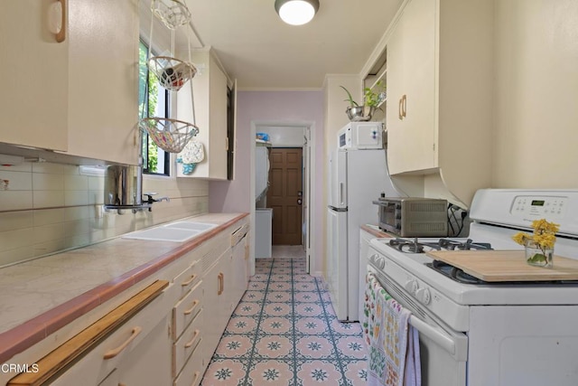 2740 Auburn St, Los Angeles, CA 90039 - kitchen with white appliances, a sink, tile counters, decorative backsplash, and white cabinetry