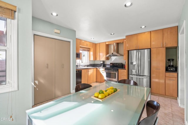2740 Auburn St, Los Angeles, CA 90039 - kitchen featuring appliances with stainless steel finishes, wall chimney range hood, a sink, light tile patterned floors, and recessed lighting