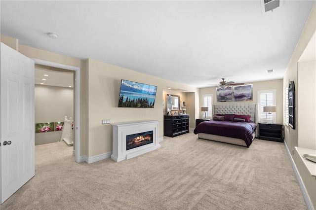 34032 Temecula Creek Rd, Temecula, CA 92592 - bedroom with carpet flooring, a glass covered fireplace, and a ceiling fan