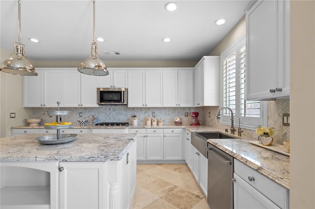 34032 Temecula Creek Rd, Temecula, CA 92592 - kitchen featuring stainless steel appliances, tasteful backsplash, recessed lighting, white cabinets, and decorative light fixtures