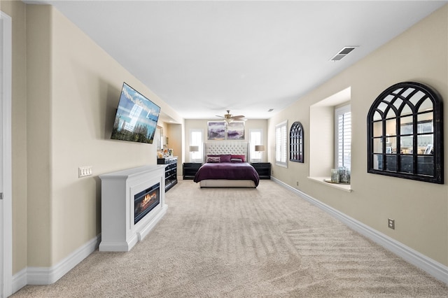 34032 Temecula Creek Rd, Temecula, CA 92592 - carpeted bedroom with a glass covered fireplace and ceiling fan