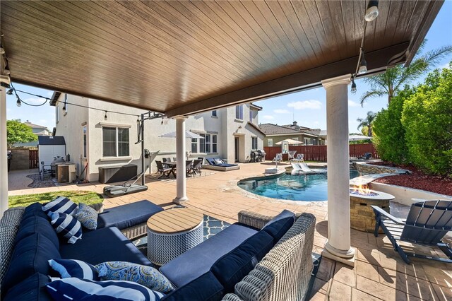 34032 Temecula Creek Rd, Temecula, CA 92592 - fenced backyard with an outdoor living space with a fire pit, a patio, and outdoor dining space