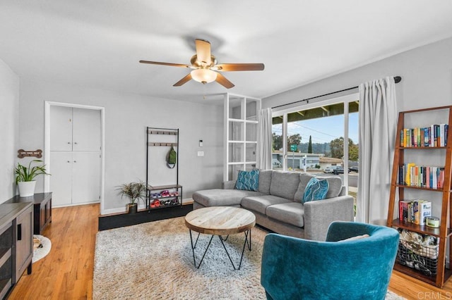 6053 Mohler St, San Diego, CA 92120 - living room featuring ceiling fan and light wood-style flooring
