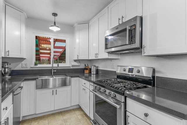 6053 Mohler St, San Diego, CA 92120 - kitchen featuring stainless steel appliances, a sink, and white cabinetry