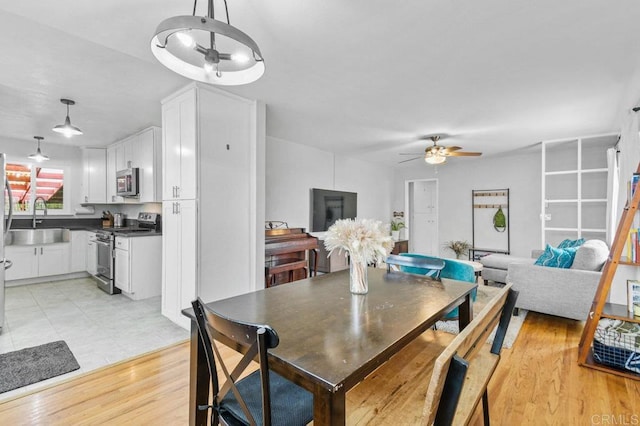 6053 Mohler St, San Diego, CA 92120 - dining room with ceiling fan and light wood-style flooring