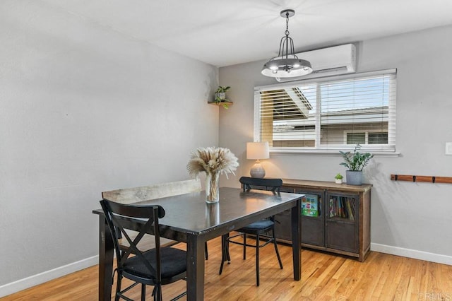 6053 Mohler St, San Diego, CA 92120 - dining space with a wall unit AC and light wood finished floors