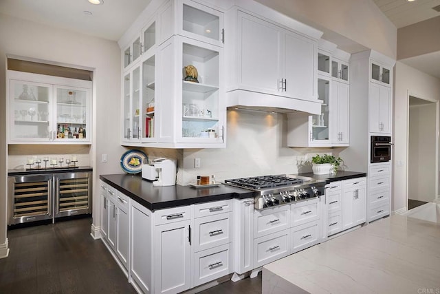 15527 Artesian Ridge Rd, San Diego, CA 92127 - kitchen featuring stainless steel appliances, white cabinetry, decorative backsplash, dark countertops, and beverage cooler
