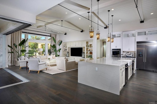 15527 Artesian Ridge Rd, San Diego, CA 92127 - kitchen with appliances with stainless steel finishes, open floor plan, white cabinetry, dark wood-style flooring, and hanging light fixtures