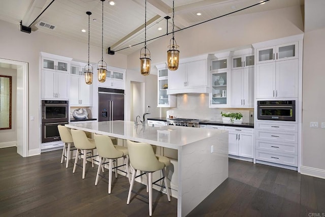 15527 Artesian Ridge Rd, San Diego, CA 92127 - kitchen featuring built in fridge, stainless steel double oven, tasteful backsplash, dark wood-type flooring, and wood ceiling with exposed beams