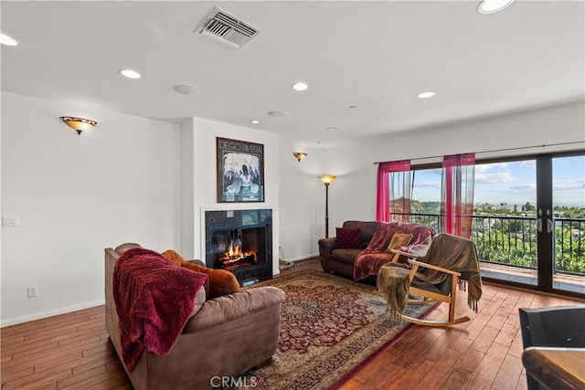 633 Sunnyhill Dr, Los Angeles, CA 90065 - living room featuring wood finished floors, a high end fireplace, baseboards, and recessed lighting