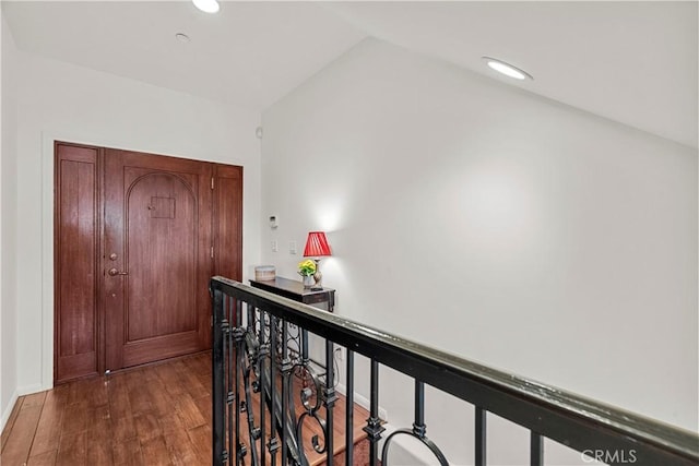 633 Sunnyhill Dr, Los Angeles, CA 90065 - hallway with wood finished floors, vaulted ceiling, an upstairs landing, and recessed lighting