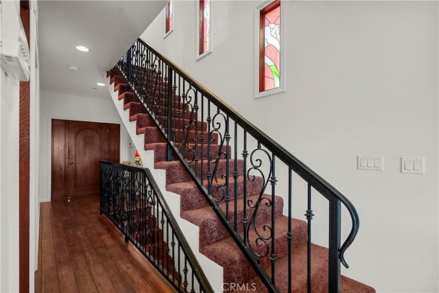633 Sunnyhill Dr, Los Angeles, CA 90065 - staircase featuring wood-type flooring and recessed lighting