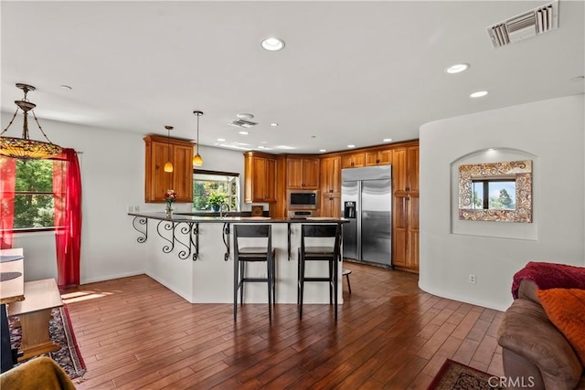 633 Sunnyhill Dr, Los Angeles, CA 90065 - kitchen featuring built in appliances, a peninsula, plenty of natural light, open floor plan, and recessed lighting