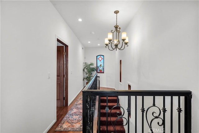 633 Sunnyhill Dr, Los Angeles, CA 90065 - corridor featuring a chandelier, dark wood-style flooring, recessed lighting, an upstairs landing, and baseboards