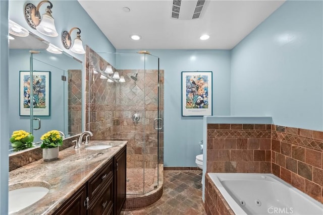 633 Sunnyhill Dr, Los Angeles, CA 90065 - full bath with a whirlpool tub, a shower stall, toilet, double vanity, and stone finish floors