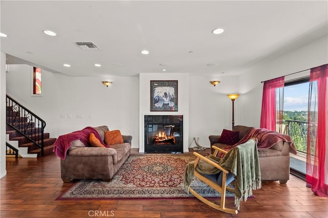 633 Sunnyhill Dr, Los Angeles, CA 90065 - living room featuring recessed lighting, a glass covered fireplace, stairway, and wood finished floors
