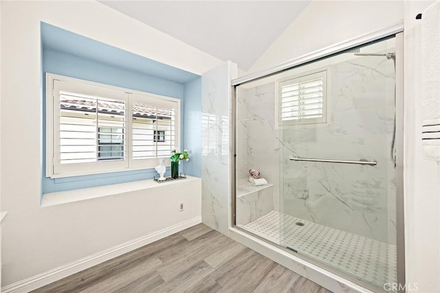 407 E Duarte Rd Unit D, Arcadia, CA 91006 - bathroom with a marble finish shower, wood finished floors, lofted ceiling, and baseboards